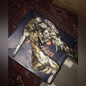 This sexy lace heel is a size 10 and are brand new